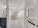 Hallway connecting spaces, with a view of a bathroom and bedroom at 5118 Luna Negra Dr, Orlando, FL 32811