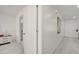 Bright hallway with white walls, light floors, and access to rooms at 5118 Luna Negra Dr, Orlando, FL 32811