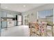 Kitchen with blue cabinets, stainless appliances, and an eat-in table at 5118 Luna Negra Dr, Orlando, FL 32811
