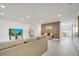 An open-concept living room with modern decor provides a spacious setting at 5118 Luna Negra Dr, Orlando, FL 32811