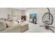 The living room features a fireplace and hanging chair at 5118 Luna Negra Dr, Orlando, FL 32811