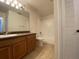 Bright bathroom with vanity, tile flooring, and a shower-tub combo at 5468 E Michigan E St # 4, Orlando, FL 32812