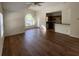 Open-concept living room with wood floors and kitchen view at 5468 E Michigan E St # 4, Orlando, FL 32812