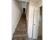 Carpeted staircase leading upstairs, with a large closet nearby at 5468 E Michigan E St # 4, Orlando, FL 32812