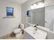 Cozy bathroom featuring modern sink and vanity, toilet, and shower/tub combination at 553 Floral Dr, Kissimmee, FL 34743