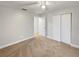 Bright bedroom featuring carpet flooring, neutral paint, ceiling fan, and closet space at 553 Floral Dr, Kissimmee, FL 34743