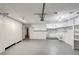 Big garage features lots of storage cabinets, overhead lighting, and a utility sink at 553 Floral Dr, Kissimmee, FL 34743