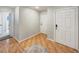 Inviting hallway featuring stylish tile flooring, fresh paint, and access to other rooms at 553 Floral Dr, Kissimmee, FL 34743