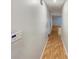 Clean hallway with tiled flooring leading to various rooms, offering great flow throughout the home at 553 Floral Dr, Kissimmee, FL 34743