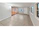 Inviting living room with tile flooring, natural light, and a door to the outside at 553 Floral Dr, Kissimmee, FL 34743