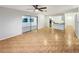 Open living room with sliding glass doors and tile flooring, seamlessly connecting indoor and outdoor spaces at 553 Floral Dr, Kissimmee, FL 34743
