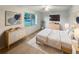 Comfortable main bedroom with large window, modern decor, and ceiling fan, perfect for relaxation at 553 Floral Dr, Kissimmee, FL 34743