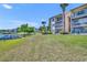 A view of the lake community with lake access and boat parking next to condos and lush green spaces at 574 Orange Dr # 78, Altamonte Springs, FL 32701
