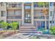A ground-level entrance with stairs leading to upper-level units in a well-maintained building at 574 Orange Dr # 78, Altamonte Springs, FL 32701