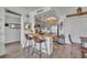 A well-lit kitchen offering bar seating, a view into the dining area and modern appliances at 574 Orange Dr # 78, Altamonte Springs, FL 32701