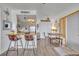 A well-lit eat-in kitchen featuring bar seating and modern appliances at 574 Orange Dr # 78, Altamonte Springs, FL 32701