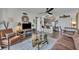 Open-concept living room blends comfort with a lake view, featuring a cozy sofa and modern kitchen bar seating at 574 Orange Dr # 78, Altamonte Springs, FL 32701