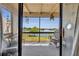 Relaxing screened patio with comfortable seating and a beautiful, unobstructed view of the tranquil lake at 574 Orange Dr # 78, Altamonte Springs, FL 32701
