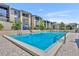 Beautiful community pool surrounded by condos with plenty of chairs available to relax on a sunny day at 574 Orange Dr # 78, Altamonte Springs, FL 32701