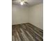 Bedroom featuring a ceiling fan, neutral paint, and wood-look flooring at 627 Dory Ln # 202, Altamonte Springs, FL 32714
