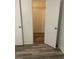 Bedroom featuring wood-look floors and a walk-in closet with open doors at 627 Dory Ln # 202, Altamonte Springs, FL 32714