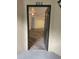 Front door showing luxury vinyl plank flooring and a view into the condo unit at 627 Dory Ln # 202, Altamonte Springs, FL 32714