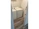 Compact laundry room featuring a washer and dryer set at 627 Dory Ln # 202, Altamonte Springs, FL 32714