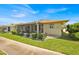A lovely home featuring a screened lanai, lush landscaping, and a well-maintained lawn for outdoor enjoyment at 633 Watercrest Dr, Haines City, FL 33844