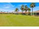 This property features a large green space and houses with screened lanais and palm trees at 633 Watercrest Dr, Haines City, FL 33844