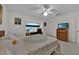 Bright bedroom featuring natural light, fan, and closet space at 633 Watercrest Dr, Haines City, FL 33844