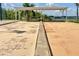 Bocce ball court under a covered pavilion surrounded by benches at 633 Watercrest Dr, Haines City, FL 33844