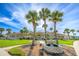 Clubhouse exterior with lush lawn, walkway, and water fountain at 633 Watercrest Dr, Haines City, FL 33844