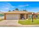 Charming single-story brick home with a well-manicured lawn and a convenient two-car garage at 633 Watercrest Dr, Haines City, FL 33844