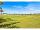 A scenic view of the golf course and pond, backing up to residential properties at 633 Watercrest Dr, Haines City, FL 33844