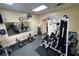 Well-equipped gym features machines, free weights and wall mirrors, promoting a healthy lifestyle at 633 Watercrest Dr, Haines City, FL 33844