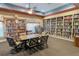 Community library with cozy seating and extensive bookshelves provides a quiet reading space at 633 Watercrest Dr, Haines City, FL 33844