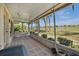 Enclosed patio with seating area overlooking scenic golf course views at 633 Watercrest Dr, Haines City, FL 33844
