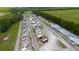 Wide aerial shot of the recreational property, displaying ample parking for RVs and boats amid picturesque scenery at 6419 Borg St, Leesburg, FL 34748