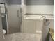 Bathroom featuring a walk-in tub, separate shower, granite countertops and tile flooring at 6419 Borg St, Leesburg, FL 34748