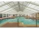 Bright indoor swimming pool with a high glass ceiling and ample natural light at 6419 Borg St, Leesburg, FL 34748