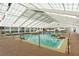 Large indoor pool features a bright, airy space and clear water at 6419 Borg St, Leesburg, FL 34748
