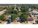 Community aerial view showcases the neighborhood's serene setting, lush greenery and homes at 6508 Coral Cove Dr, Orlando, FL 32818
