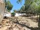 Large fenced backyard with mature trees providing shade and a private outdoor retreat at 6508 Coral Cove Dr, Orlando, FL 32818