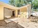 Back of the home with patio and sliding glass door to interior at 6508 Coral Cove Dr, Orlando, FL 32818