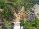Expansive backyard with mature trees and partial fencing, offering a private outdoor space at 6508 Coral Cove Dr, Orlando, FL 32818