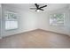 Bright bedroom with light floors, ceiling fan and windows at 6508 Coral Cove Dr, Orlando, FL 32818