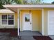 Charming front entry with well-maintained door, inviting curb appeal and covered porch at 6508 Coral Cove Dr, Orlando, FL 32818