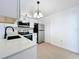 Bright kitchen with stainless steel appliances, modern countertops, and sleek white cabinetry at 6508 Coral Cove Dr, Orlando, FL 32818