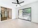Open living room with sliding glass doors to backyard at 6508 Coral Cove Dr, Orlando, FL 32818