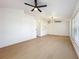 Bright living room with wood floors, recessed lighting, and a modern ceiling fan at 6508 Coral Cove Dr, Orlando, FL 32818